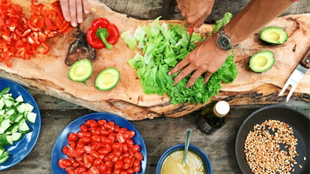 A charcuterie board highlighted by fresh garden vegetables grown by the Lush Valley Food Action Society local farmer partners.