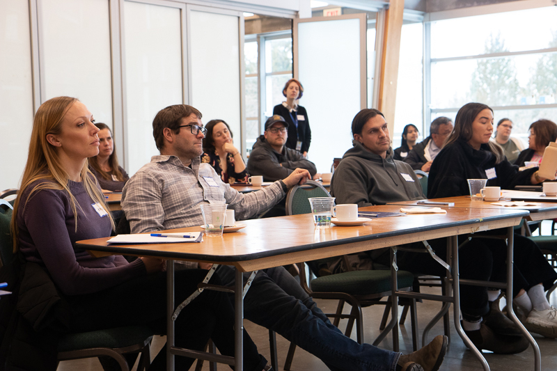 A group of students attend class at the Seafood Business Incubator