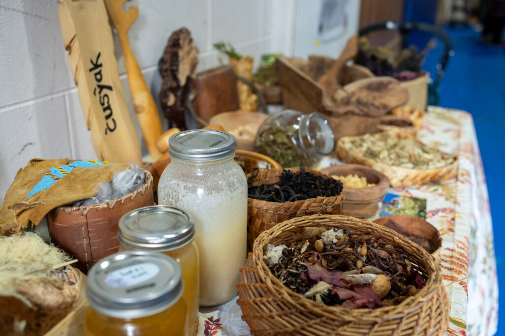 Nitanis Desjarlais, Traditional Foods Activator with Ahousaht First Nation, setup a table showcasing traditional foods harvested from across the Ahousaht First Nation Territory.