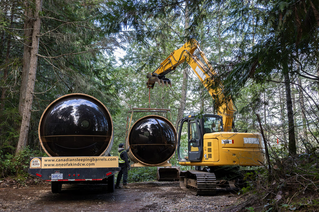By clearly showcasing the CanadianSleepingBarrels.com signage, this image acknowledges their vital role in the project.