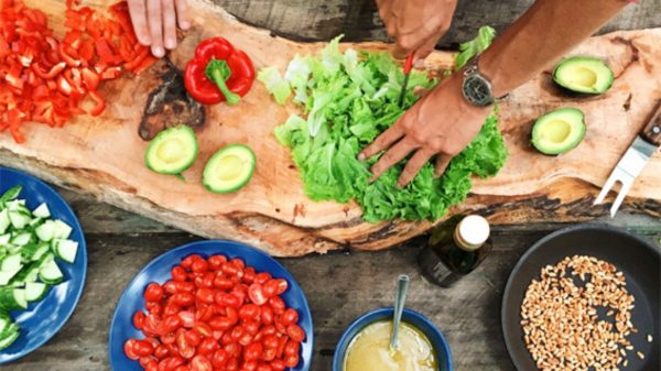 A charcuterie board highlighted by fresh garden vegetables grown by the Lush Valley Food Action Society local farmer partners.